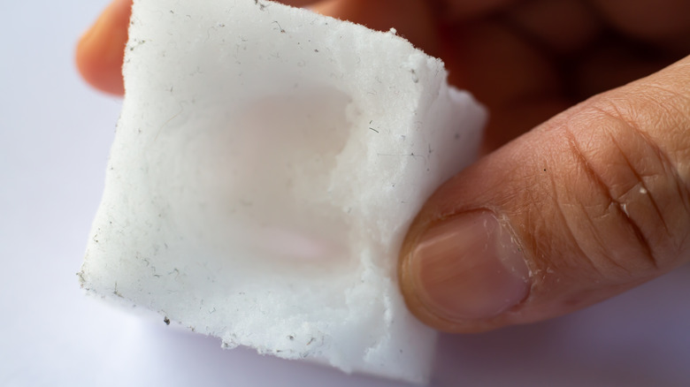 woman using magic eraser