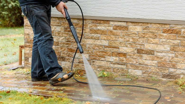 hot pressure washer cleaning patio 