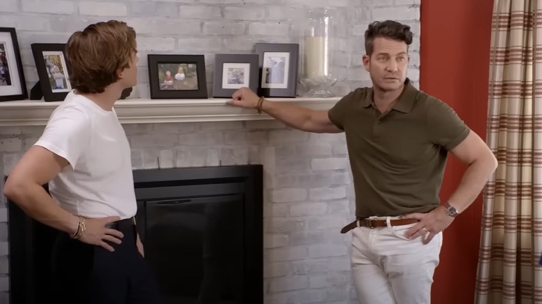 Nate Berkus with whitewashed fireplace