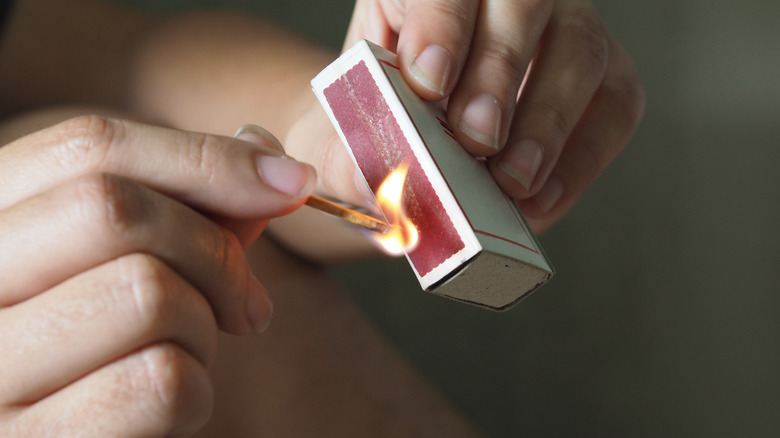 Lighting a match