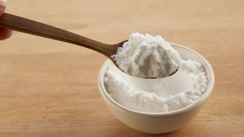 Baking soda in a bowl and spoon