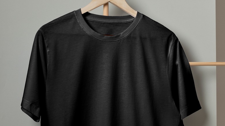 Black T-shirt on hanger