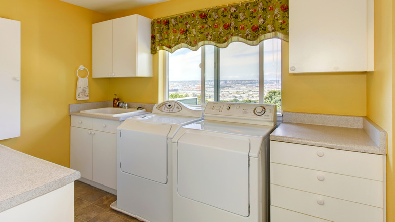 laundry room with older washing machine