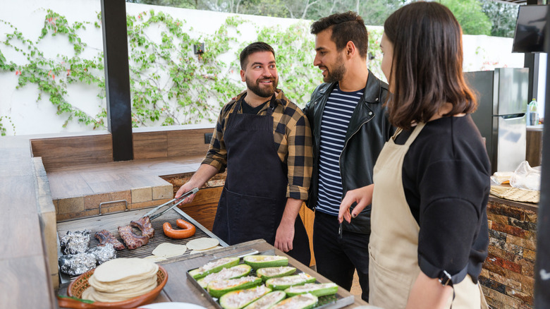 friends in outdoor kitchen