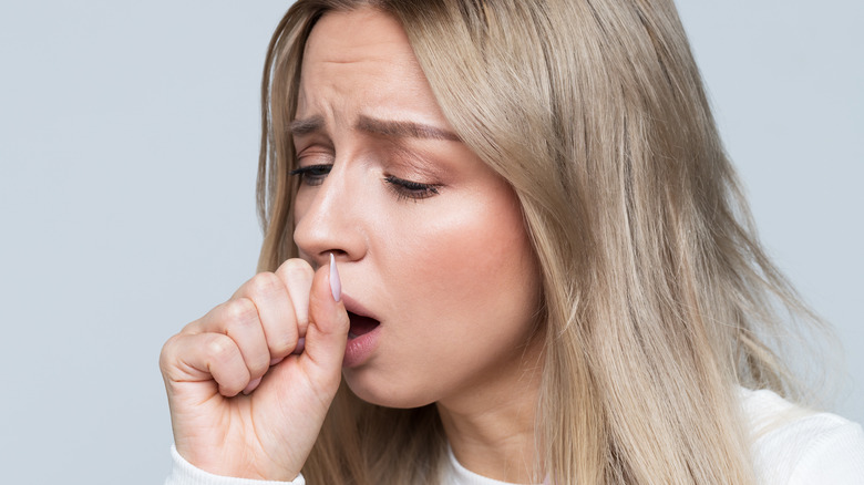 Woman coughing