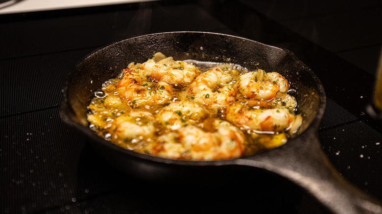 Shrimp scampi cooking in cast iron