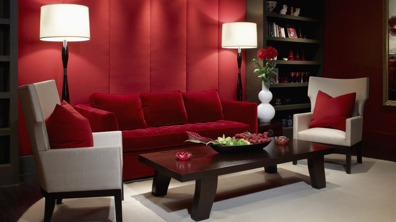 room with red walls and couch