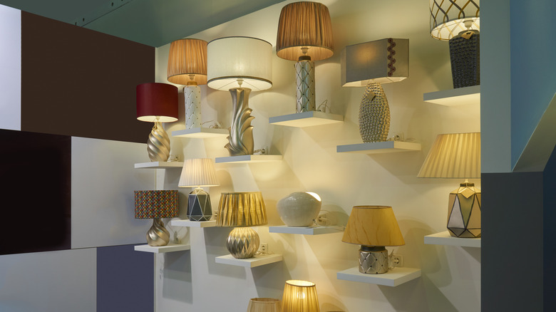 lots of lamps on shelves