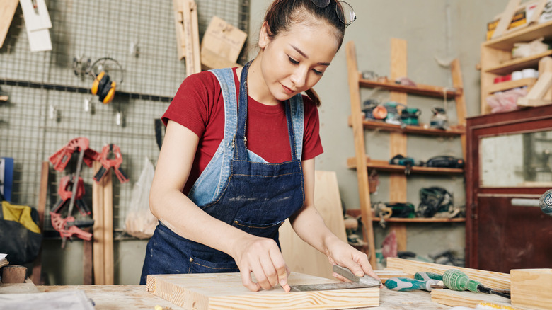 Woman doing woodwork