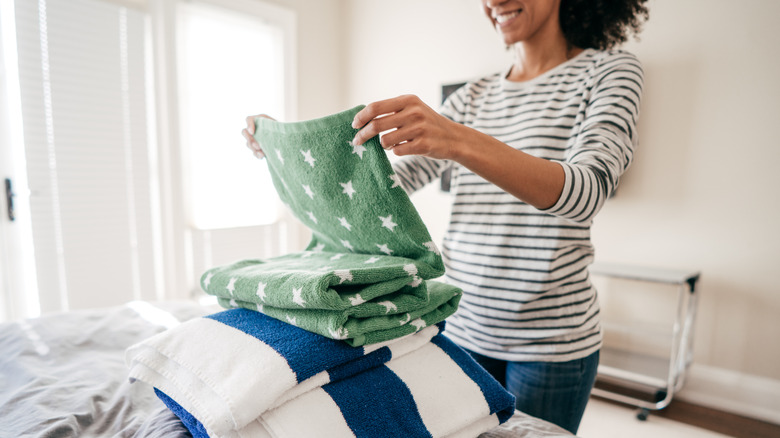 Woman folding laundry