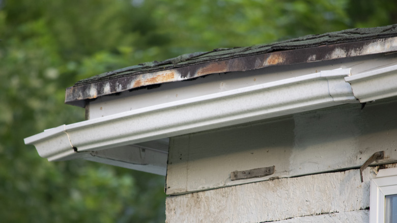 broken pieces of white gutter 