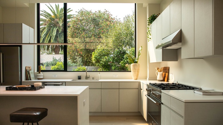 Large window behind kitchen sink