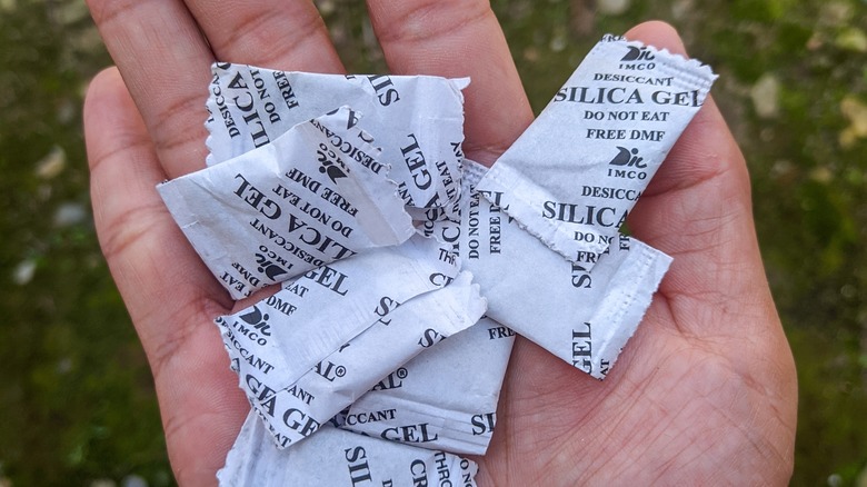 holding silica gel packets