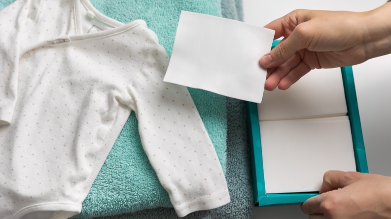 Baby onesie with laundry sheet