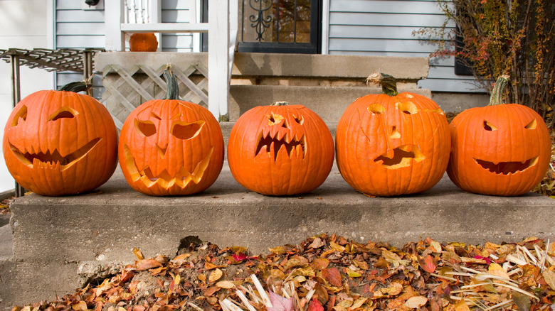 carved jack-o-lanterns on front stairs