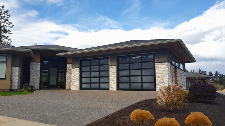 Home with two glass garage doors