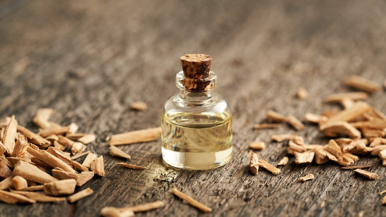 bottle of oil on wooden chips