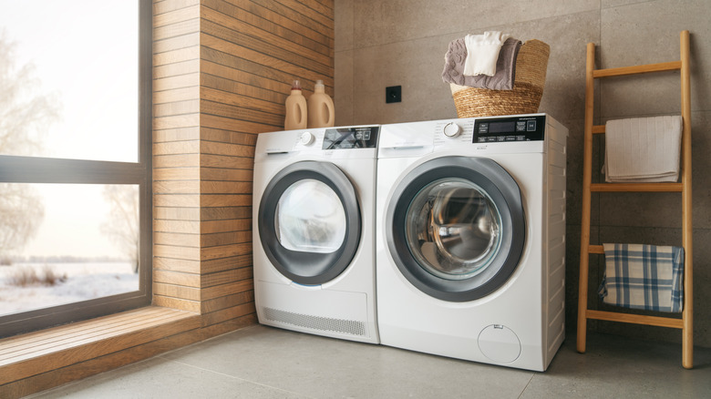 laundry room with tile on floor and ceiling