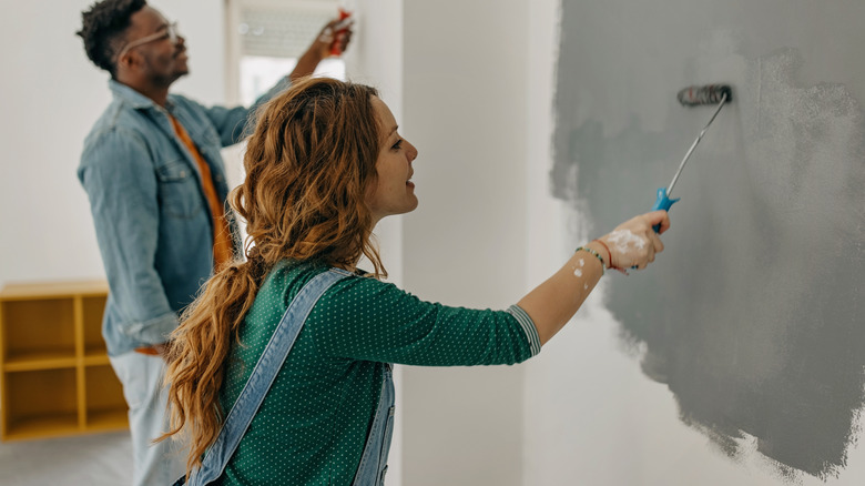 woman painting a wall