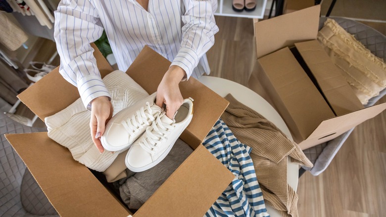 Person placing items in box