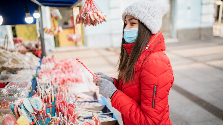 Woman shopping for candy canes