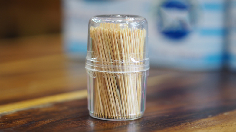 Plastic container of toothpicks