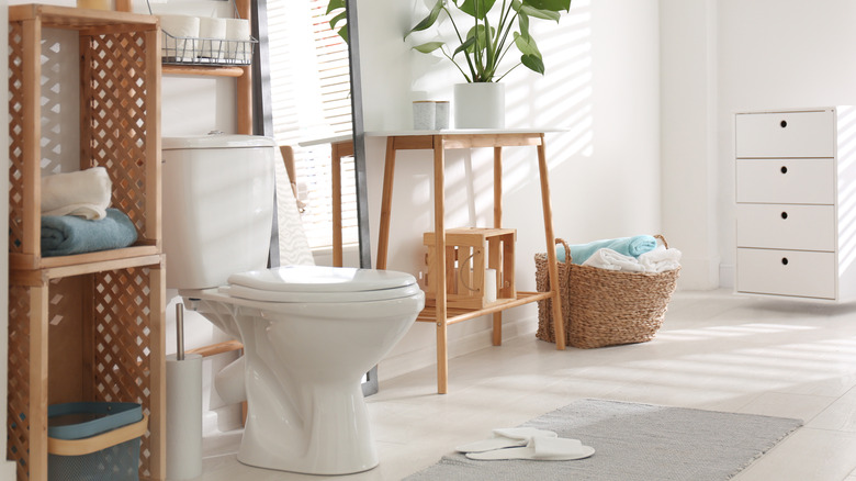 White bathroom with wood furniture