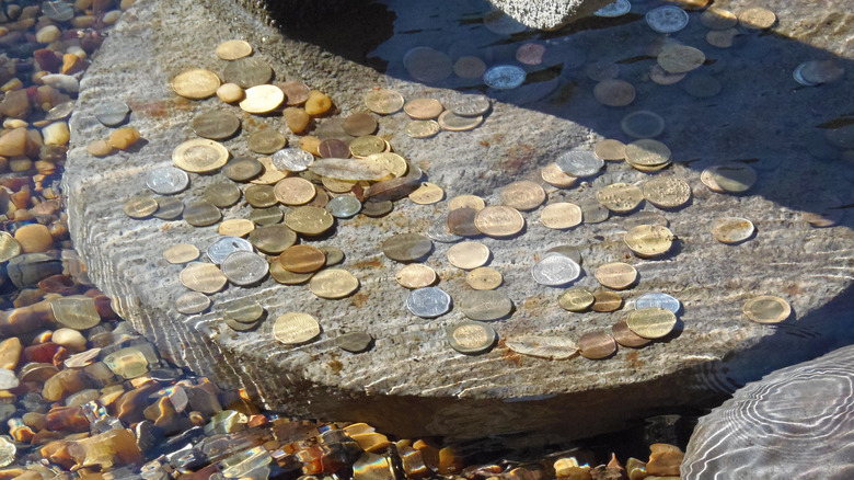 Coins at bottom of water fountain