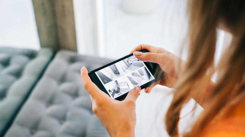 woman watching home security cameras