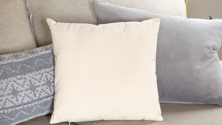 Gray and off-white throw pillows