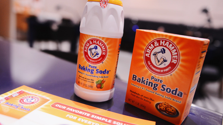 Containers of baking soda on countertop