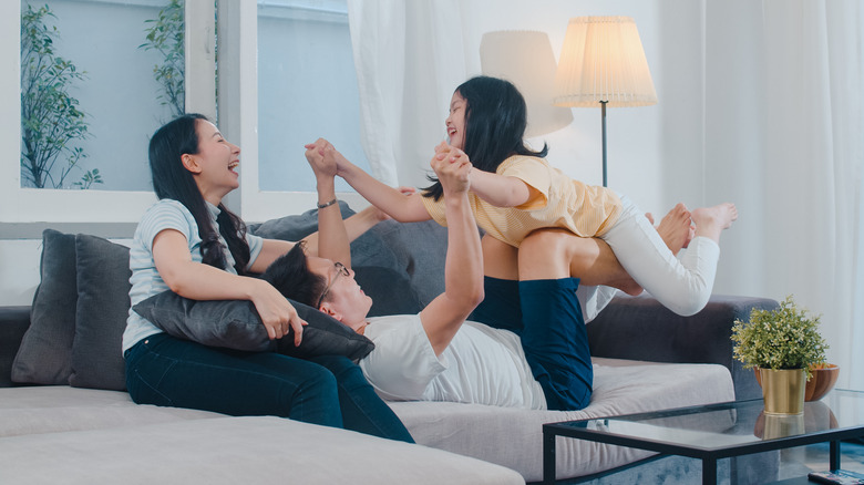 Family playing in living room