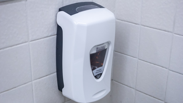 a soap dispenser in restroom