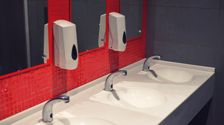 restroom sinks and soap dispensers