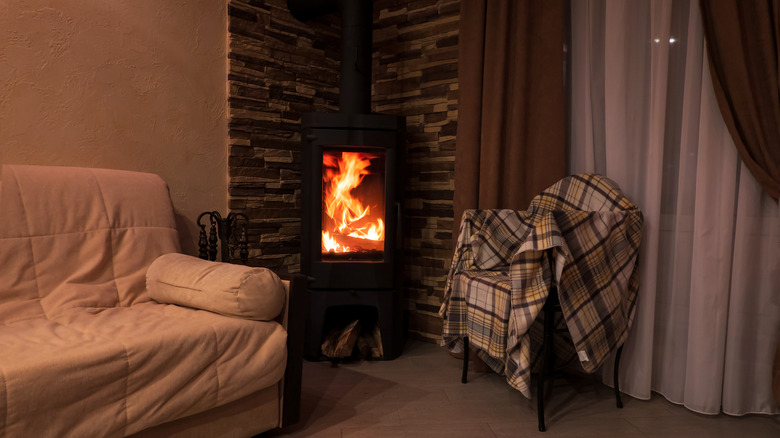 wood-burning stove near fabrics