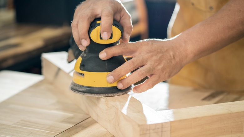 Man using a sander