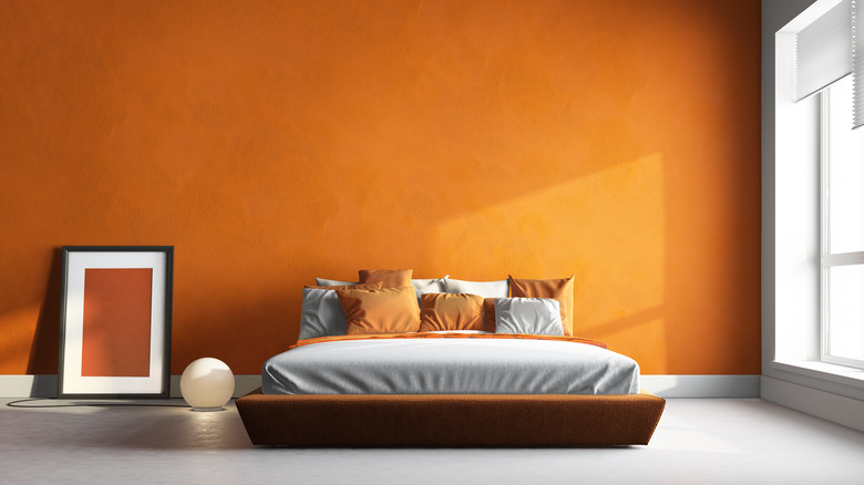 Orange wall in bedroom