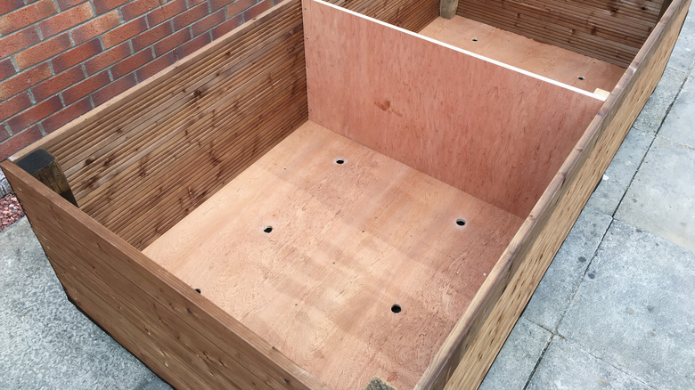Empty DIY wood planter box without finish or paint