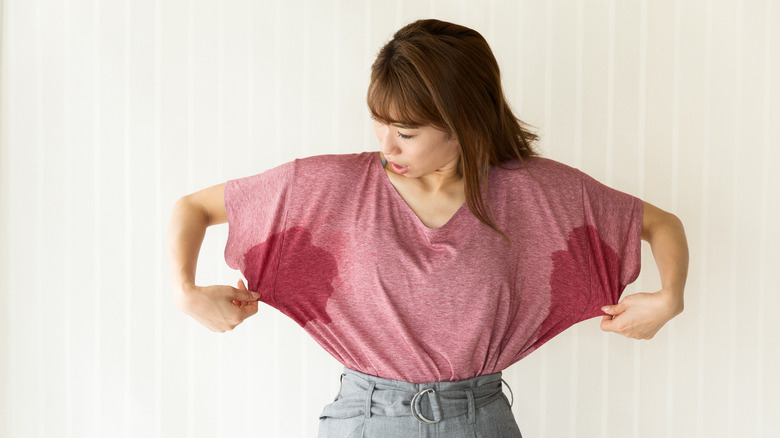 Woman looking at pit stains