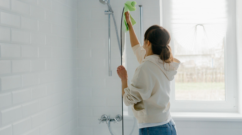 woman cleaning shower