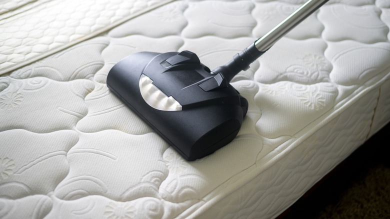 Vacuuming mattress with attachment