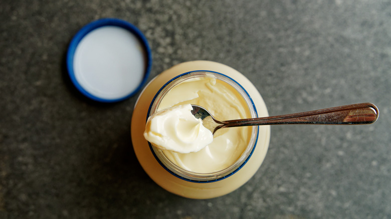 Mayonnaise with spoon in jar