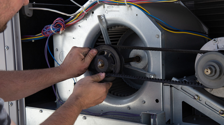 hvac professional installing motor