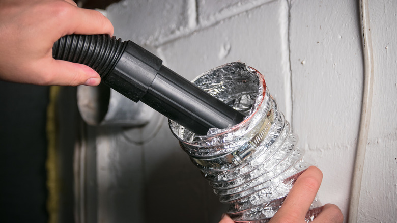 Cleaning dryer vent with vacuum