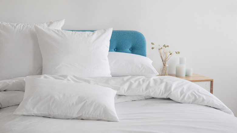 white pillows on a bed