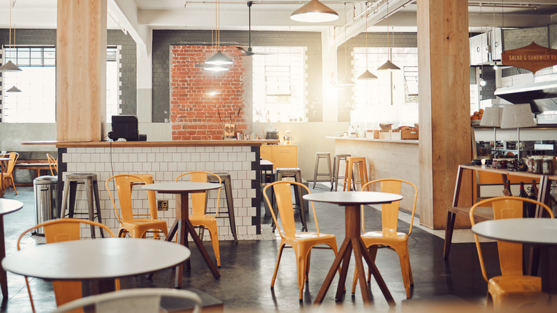 orange tolix chairs in cafe