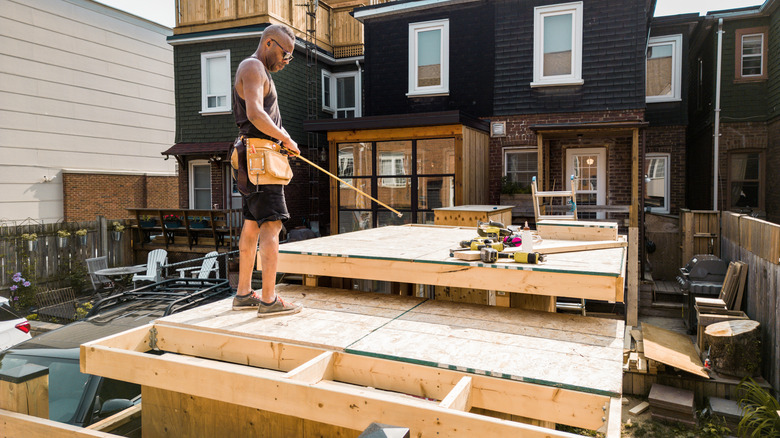 Man building shed