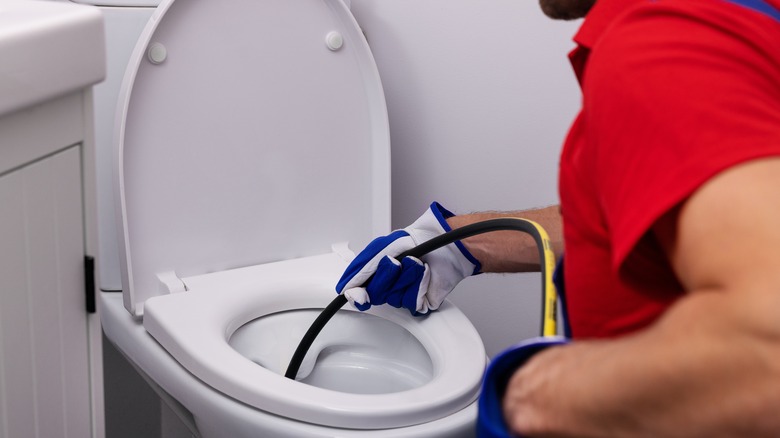 Plumbing unclogging toilet