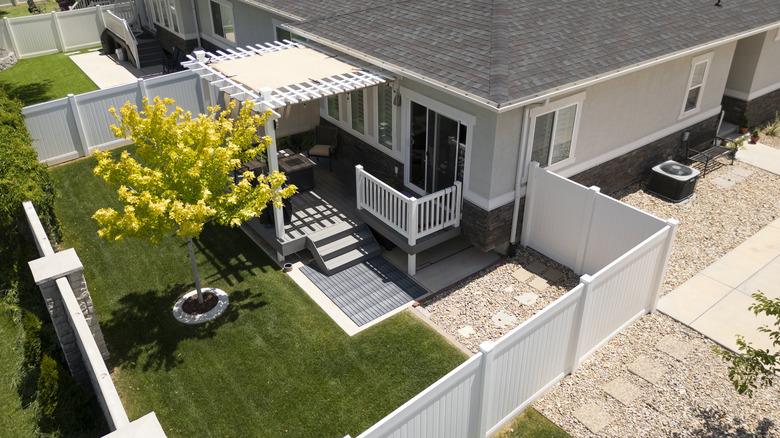 aerial view of home with fence around back yard