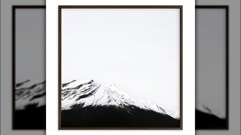 framed art of snowy mountains